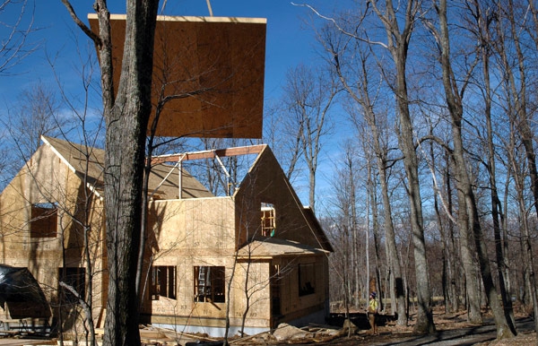 “Flying in” a roof panel on a project for Macfarlane Homes, VA, 2006