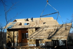 Lifting a roof panel into place on a project for Macfarlane Homes, Va, 2006